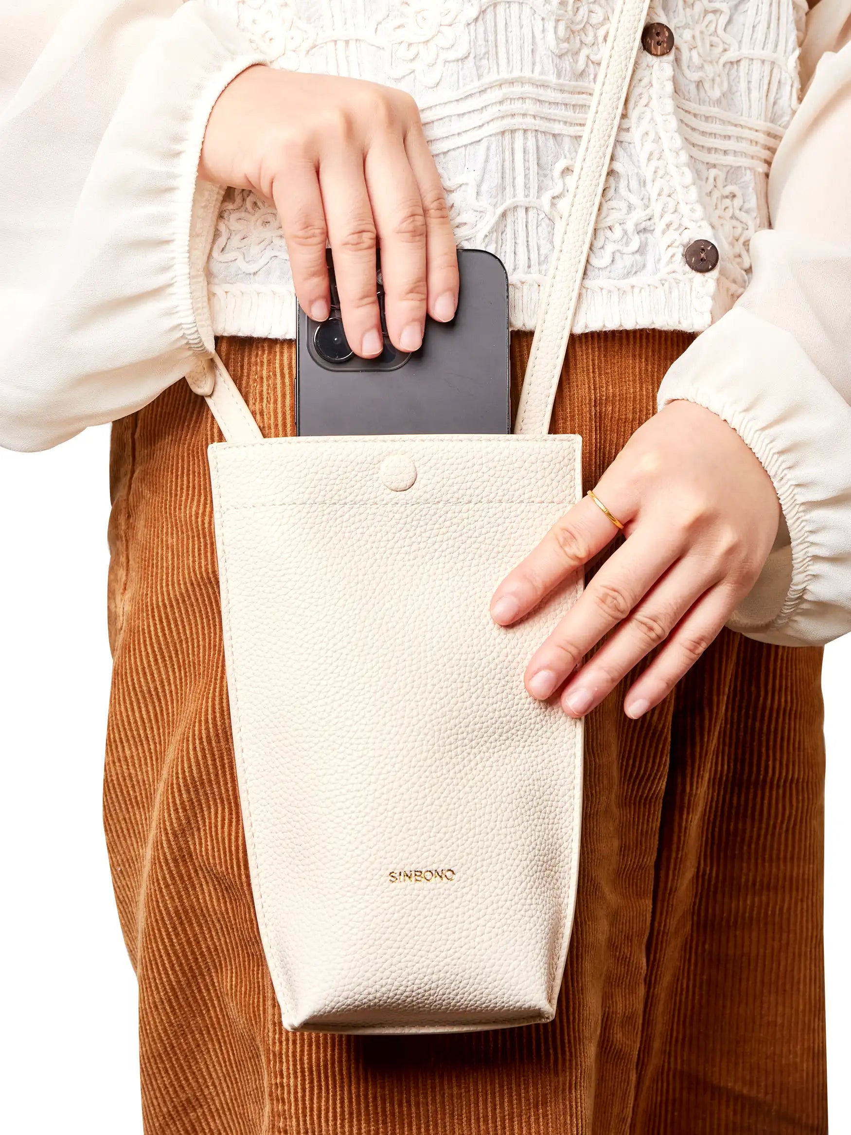 Sharla Crossbody Wallet Phone Bag in Ivory Vegan Leather - Close-Up Handheld
