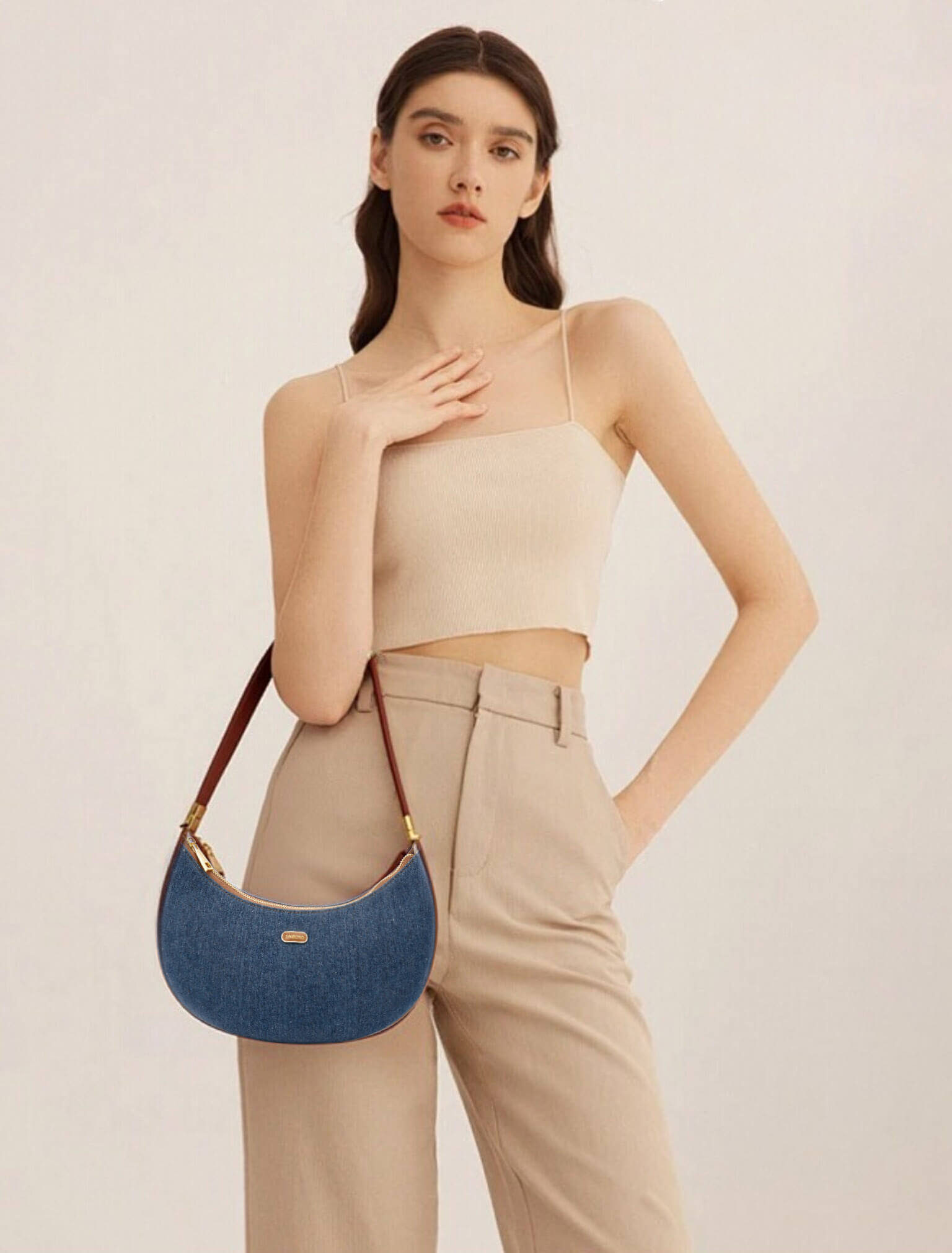 Zoey Shoulder Crossbody Bag  in Dark Blue&Brown Denim texture Leather - Model Holding Front View